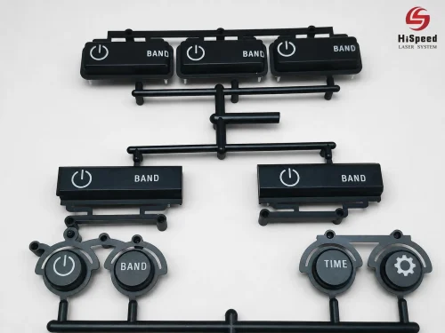 black_plastic_backlit_buttons_with_power_band_and_time_symbols_laser_marked_by_hispeed_laser_system